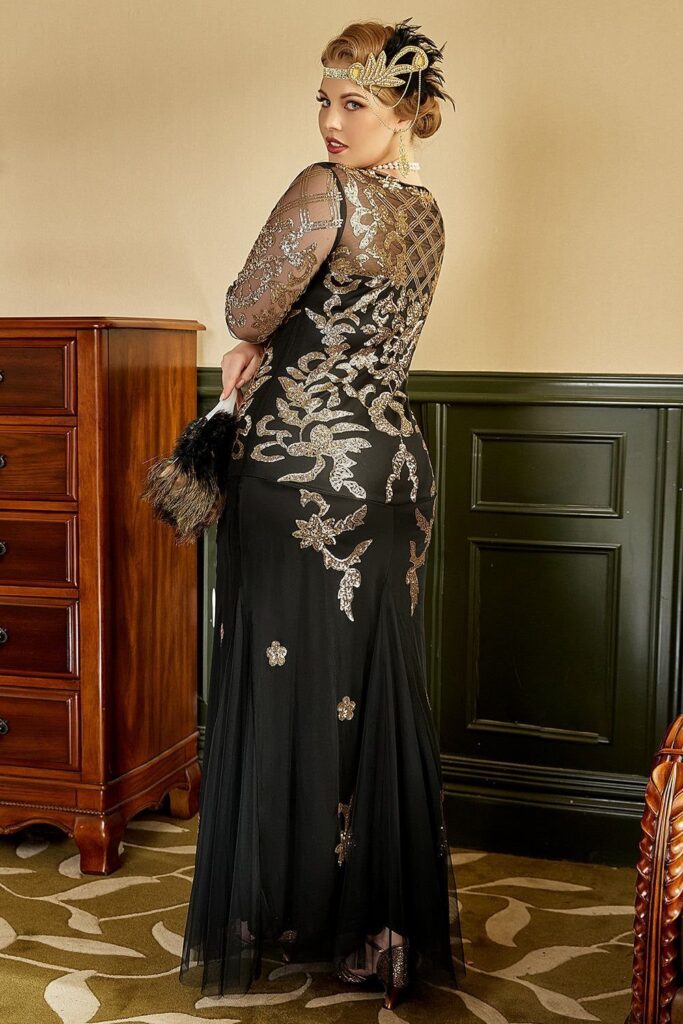 Woman wearing a black and gold sequined 1920s flapper style evening gown and headband.