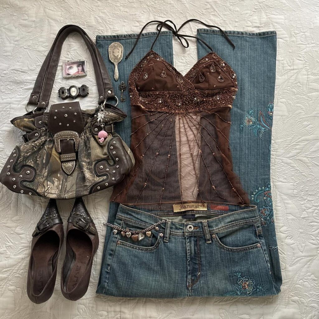 Blue embroidered jeans paired with a brown lace halter top and a camouflage handbag.